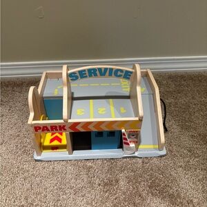 Melissa & Doug Wooden Service Station Parking Garage in Blue, Yellow, Gray